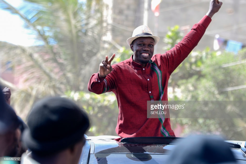 Senegalese opposition MP and presidential candidate, Ousmane Sonko, gestures as he launches his campaign for the upcoming presidential election on February 3, 2019, in the district of Ngor in Dakar. - Ousmane Sonko, a rising opposition MP and the president of the Pastef (Patriotes du Senegal pour le Travail, l'Ethique et la Fraternite) party, will be candidate for the first round of the upcoming Senegalese presidential election on February 24, 2019. The 44-year-old former tax inspector was elected for the first time to the National Assembly of Senegal in 2017. (Photo by SEYLLOU / AFP) (Photo credit should read SEYLLOU/AFP/Getty Images)